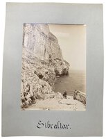 Photograph of two gentleman by the Rock of Gibraltar by [ANON]