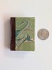 Another image of BIBLIOGRAPHY of BOOKS MADE BY PETER AND DONNA THOMAS - SIGNED by BOTH PETER & DONNA - LIMITED EDITION HANDMADE MINIATURE BOOK #157/200 by Peter and Donna Thomas